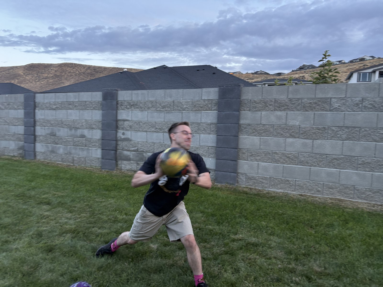 A Bolar catching a thrown bola mid-motion.